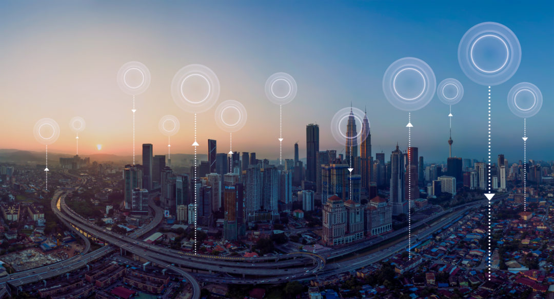Illustration of a smart city using IoT technology for traffic management, environmental monitoring, and public safety, representing smart city decision-making in action.